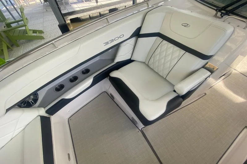 Slide: The Image of Luxurious seating in 2021 Regal 3300 Bowrider boat, featuring elegant white upholstery. - 32