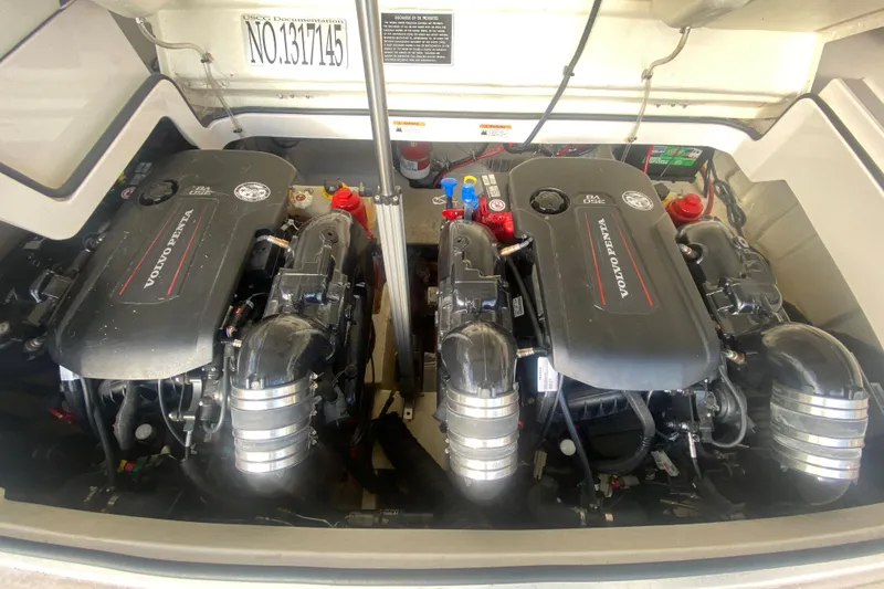 Slide: The Image of Twin Volvo Penta engines in a 2021 Regal 3300 Bowrider boat engine compartment. - 39