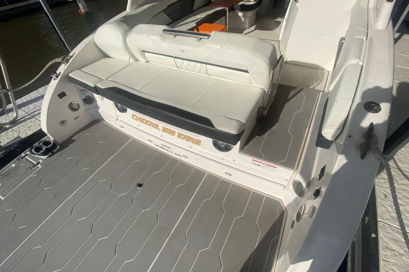 Slide: The Image of 2021 Regal 3300 Bowrider boat with spacious seating and sleek design. - 8