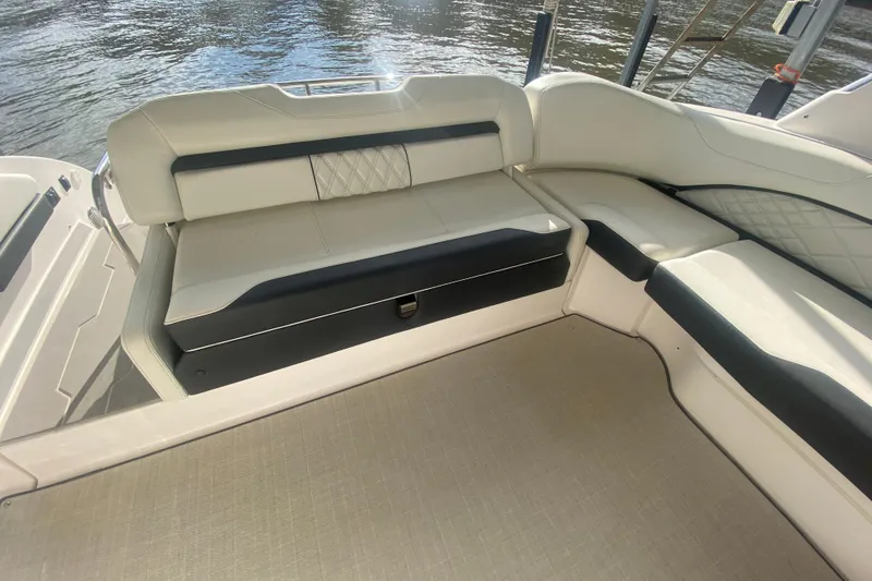 Slide: The Image of 2021 Regal 3300 Bowrider interior with elegant seating and water view. - 9