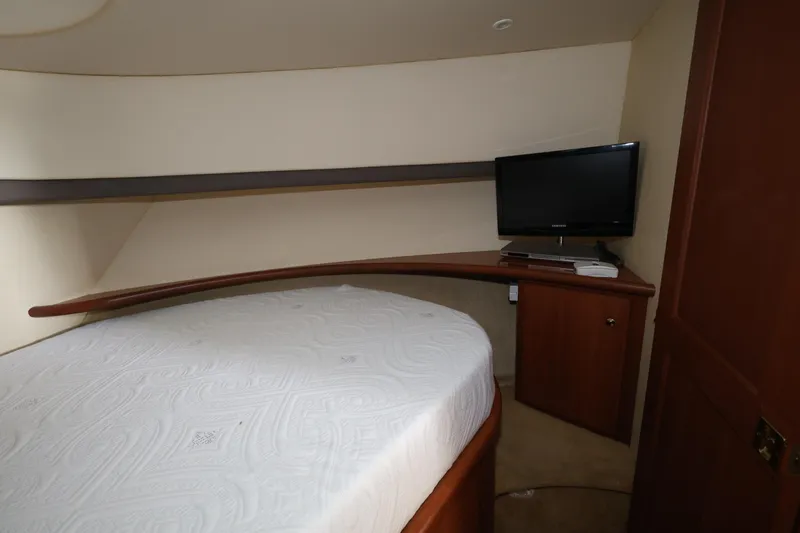 Slide: The Image of Interior cabin of 2005 Silverton 34 Convertible yacht with bed and TV. - 14