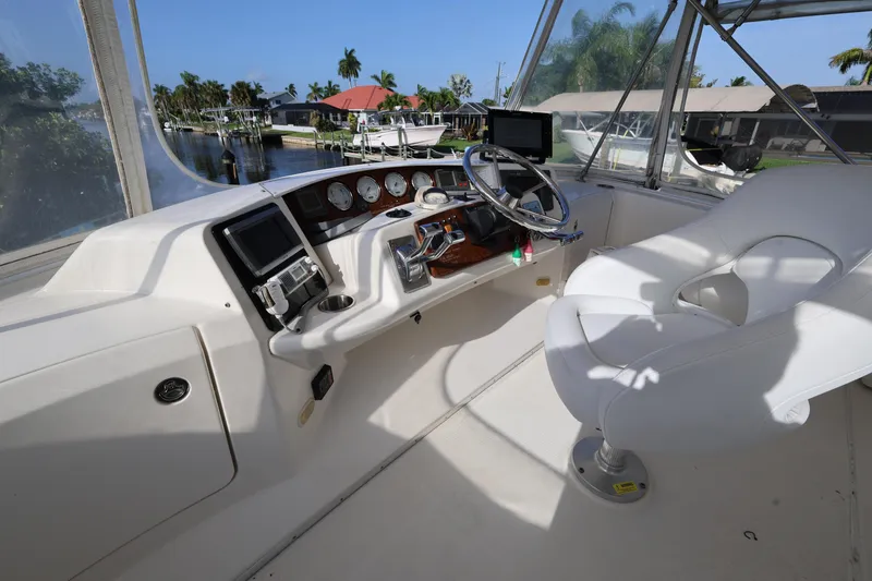 Slide: The Image of Helm of 2005 Silverton 34 Convertible yacht with steering wheel and navigation instruments. - 21