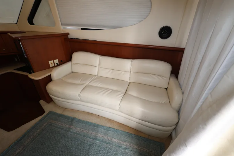 Slide: The Image of Luxurious interior of 2005 Silverton 34 Convertible yacht with cream leather sofa. - 8