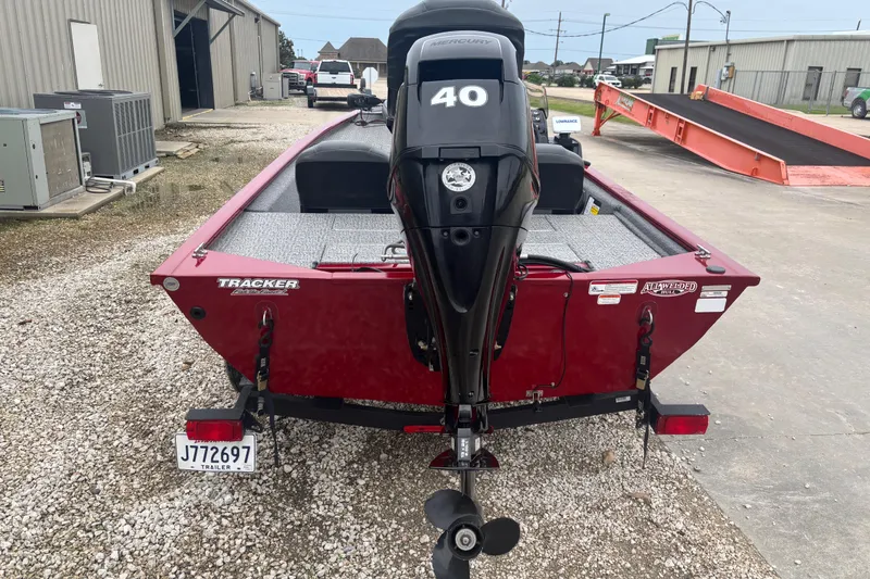 Slide: The Image of 2020 Tracker Pro 170 boat with Mercury 40 engine, parked on gravel. - 4