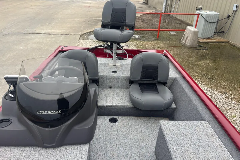 Slide: The Image of 2020 Tracker Pro 170 boat interior with gray seating and steering console. - 6