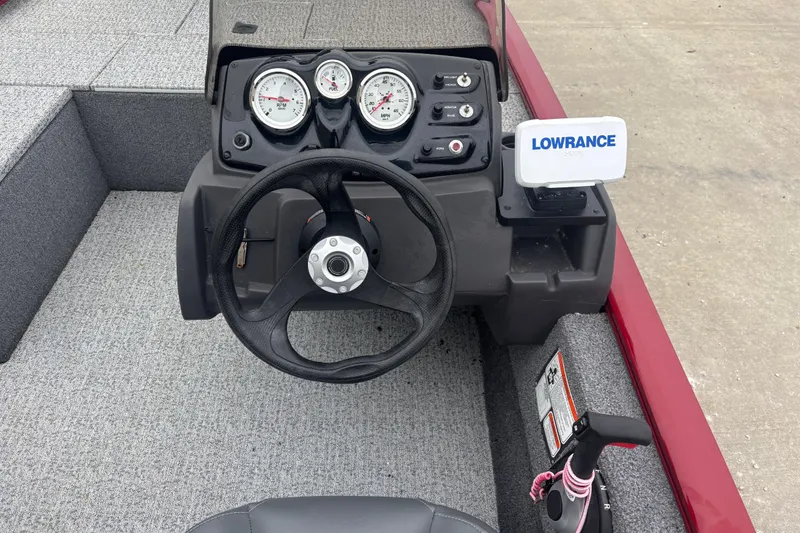 Slide: The Image of 2020 Tracker Pro 170 boat dashboard with steering wheel and Lowrance fish finder. - 8