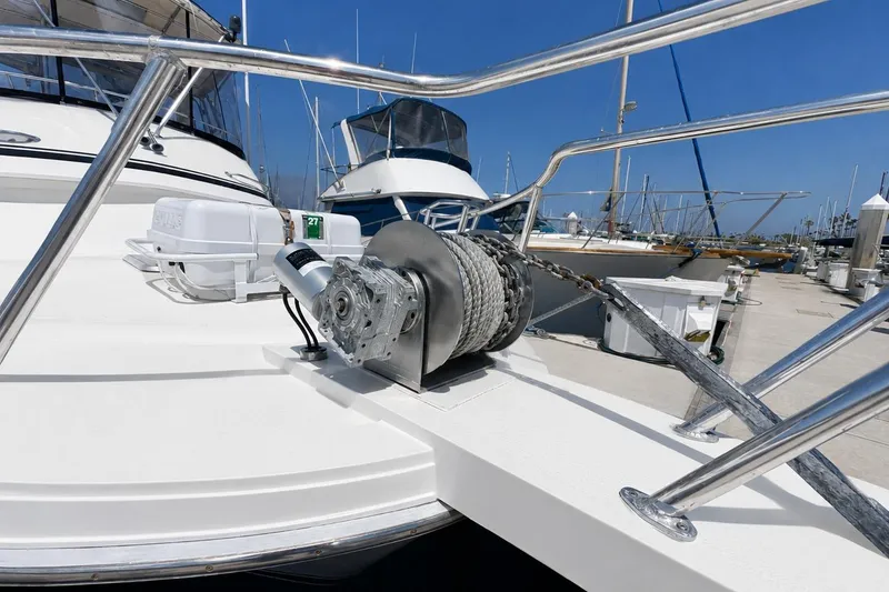 Slide: The Image of 1991 Blackfin 33 Flybridge yacht with anchor winch at marina dock. - 3