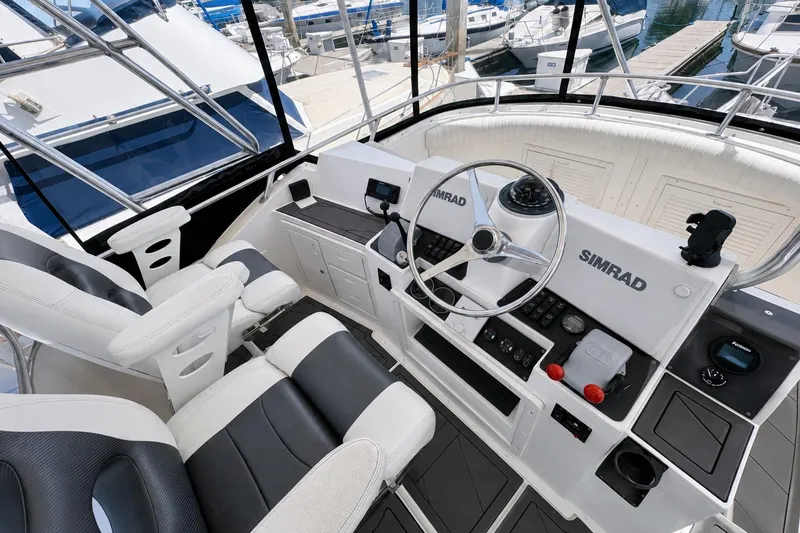 Slide: The Image of Cockpit of 1991 Blackfin 33 Flybridge with Simrad navigation system and dual seating. - 5