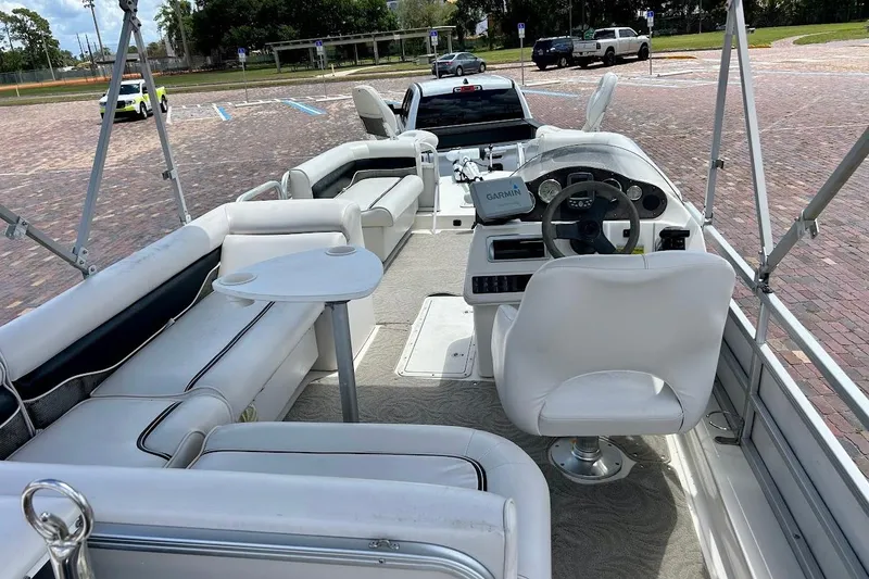 Slide: The Image of 2008 Hurricane FunDeck 226 RE boat interior with seating and steering console. - 14