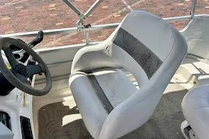 Slide: The Image of 2008 Hurricane FunDeck 226 RE boat interior with steering wheel and seating. - 25