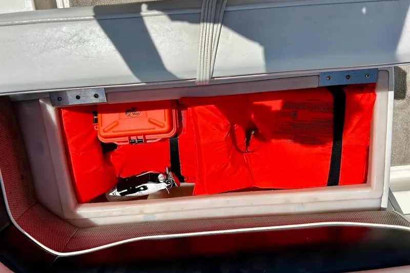 Slide: The Image of Storage compartment of 2008 Hurricane FunDeck 226 RE with safety gear and equipment. - 28