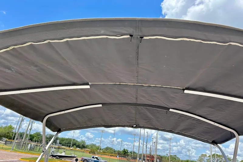 Slide: The Image of Bimini top of 2008 Hurricane FunDeck 226 RE boat under blue sky. - 36
