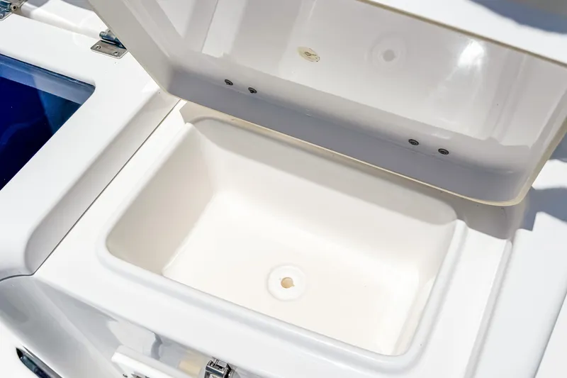 Slide: The Image of Open storage compartment on 2023 Tidewater 280 CC Adventure boat. - 15