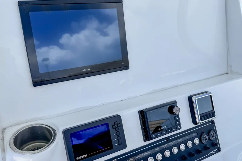 Slide: The Image of Dashboard of 2023 Tidewater 280 CC Adventure boat with Garmin and Yamaha displays. - 21