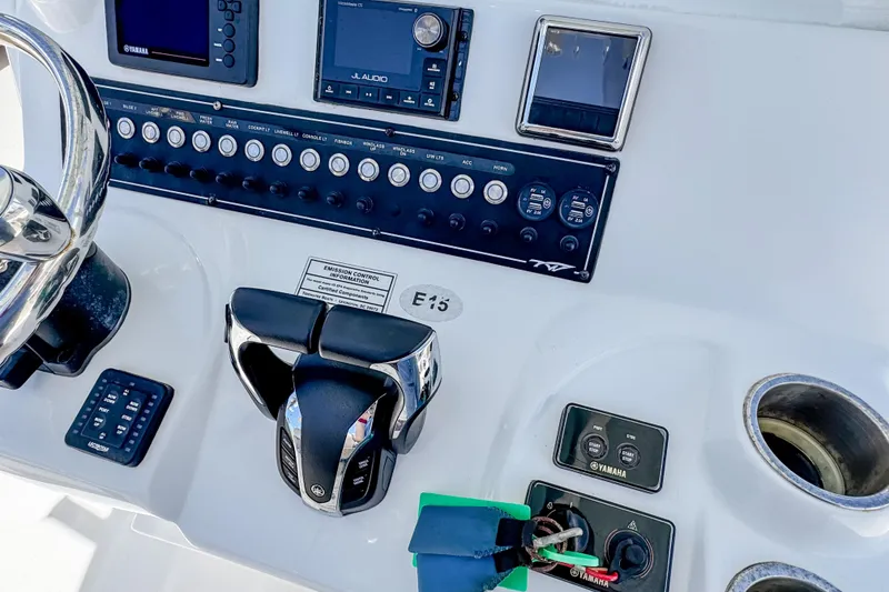 Slide: The Image of Control panel of 2023 Tidewater 280 CC Adventure boat with steering and electronic controls. - 22