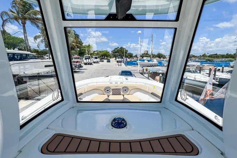 Slide: The Image of Interior view of 2023 Tidewater 280 CC Adventure boat at marina. - 23