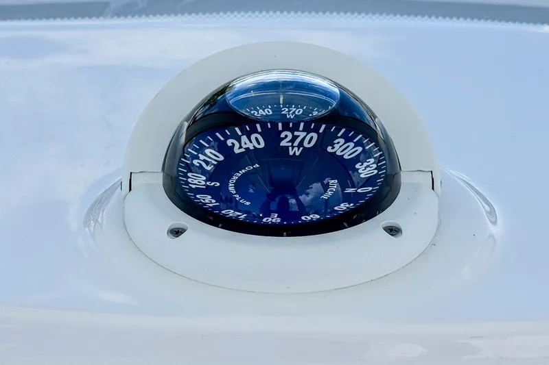 Slide: The Image of Compass on 2023 Tidewater 280 CC Adventure boat dashboard. - 24