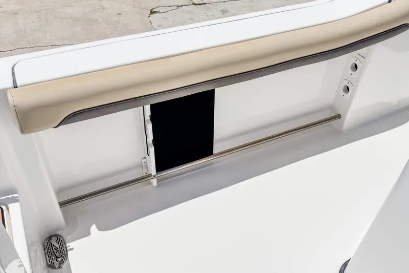 Slide: The Image of 2023 Tidewater 280 CC Adventure boat interior detail with cushioned rail and stainless steel accents. - 26