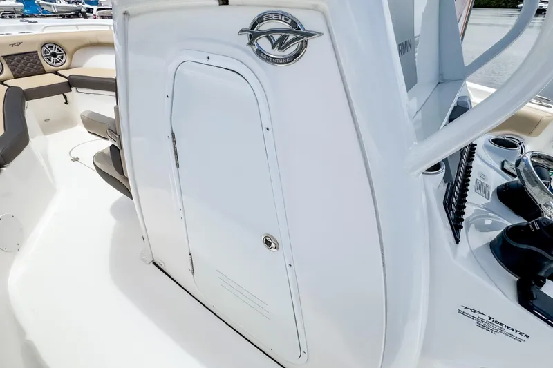 Slide: The Image of 2023 Tidewater 280 CC Adventure boat interior with helm and seating area. - 29