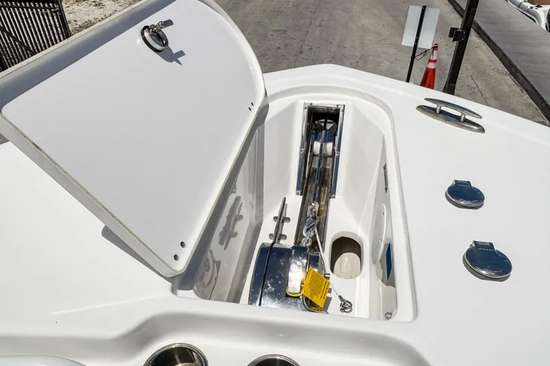 Slide: The Image of Open anchor compartment on 2023 Tidewater 280 CC Adventure boat deck. - 33
