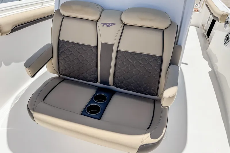 Slide: The Image of 2023 Tidewater 280 CC Adventure boat seat with cup holders and armrests. - 35