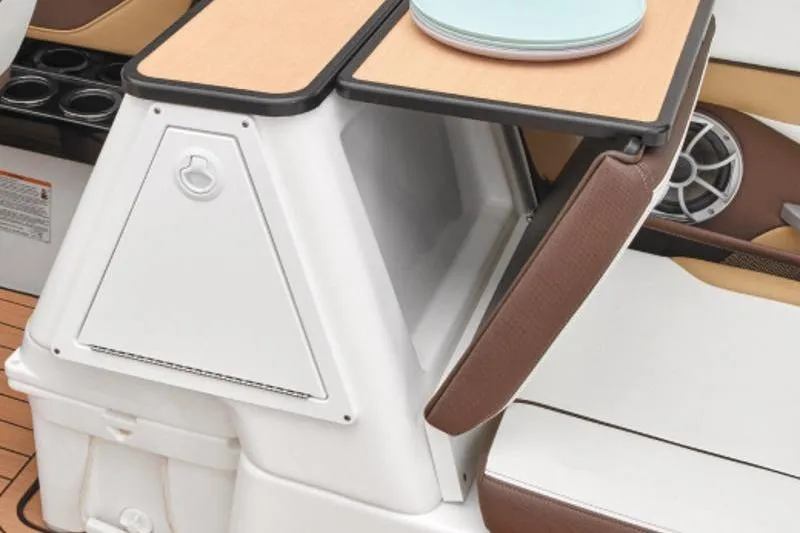 Slide: The Image of 2023 Yamaha Boats 252SE interior with storage compartment and seating area. - 5