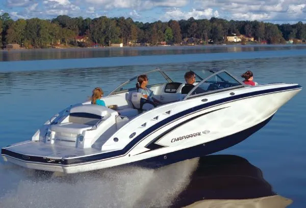 Slide: The Image of Manufacturer Provided Image: 2012 Chaparral 244 Sunesta boat cruising on a lake with passengers. - 13