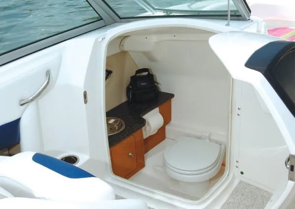Slide: The Image of Manufacturer Provided Image: 2012 Chaparral 244 Sunesta boat interior with toilet and sink. - 17