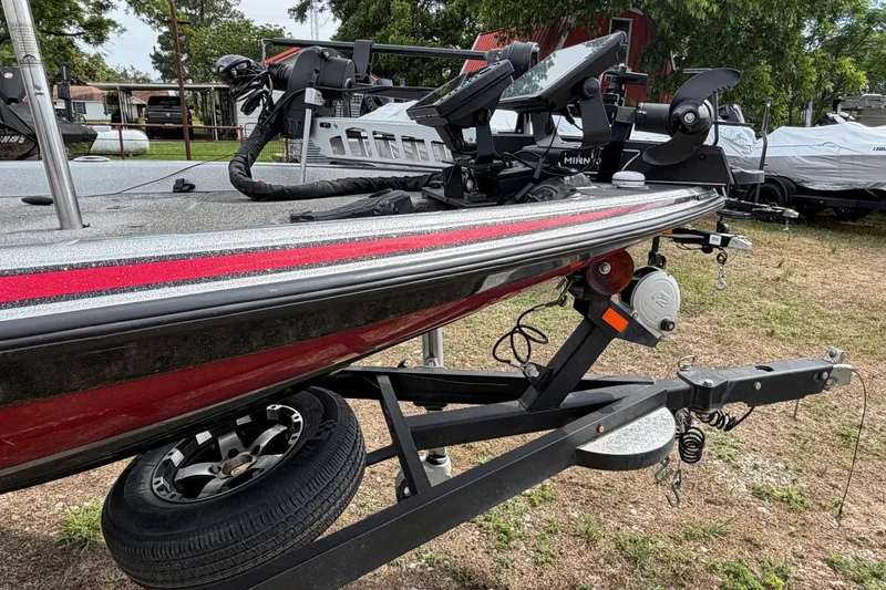 Slide: The Image of 2019 Phoenix 920 ProXP boat on trailer, featuring red and black detailing. - 1