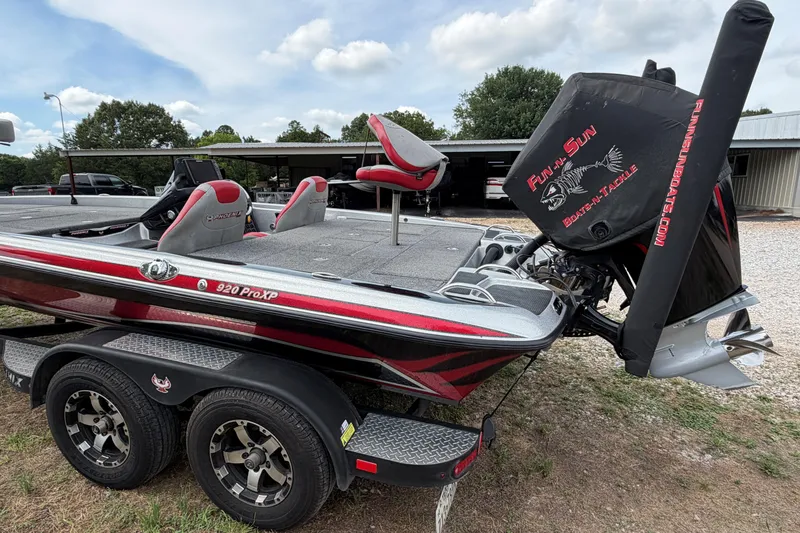 Slide: The Image of 2019 Phoenix 920 ProXP boat with red accents and Fun-n-Sun branding. - 2