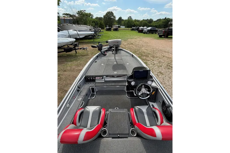 Slide: The Image of 2019 Phoenix 920 ProXP boat interior with red seats and steering console. - 3
