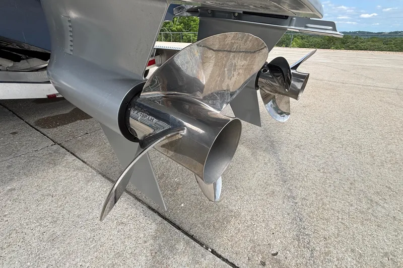 Slide: The Image of Close-up of 2026 Monterey Elite 30 OB boat propellers on concrete surface. - 10