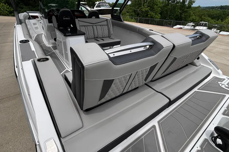 Slide: The Image of 2026 Monterey Elite 30 OB boat interior with luxurious seating and modern design. - 14