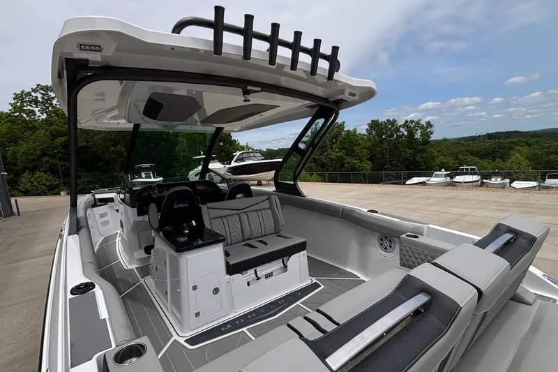Slide: The Image of 2026 Monterey Elite 30 OB boat interior with sleek seating and modern design. - 15