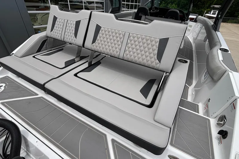 Slide: The Image of 2026 Monterey Elite 30 OB boat interior with luxurious seating and modern design. - 16