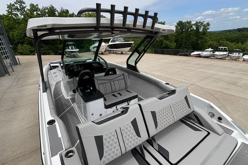 Slide: The Image of 2026 Monterey Elite 30 OB boat interior with modern seating and sleek design. - 17