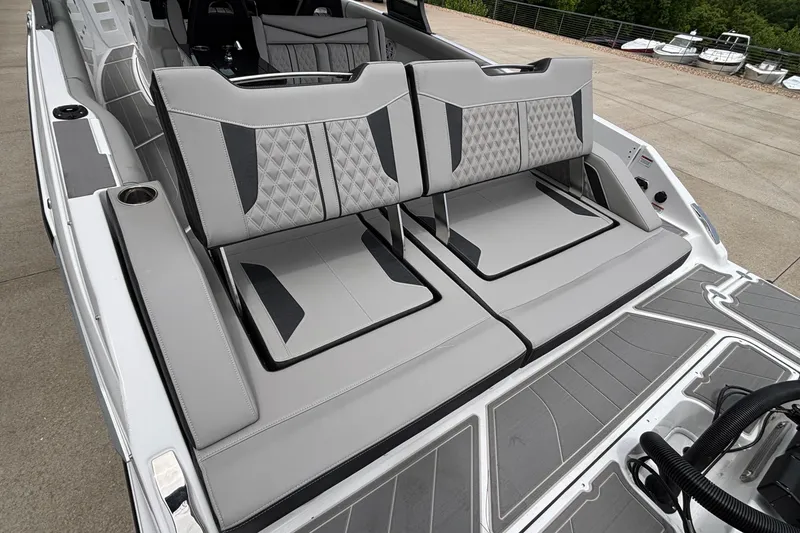 Slide: The Image of 2026 Monterey Elite 30 OB boat with luxurious gray seating and modern design. - 18