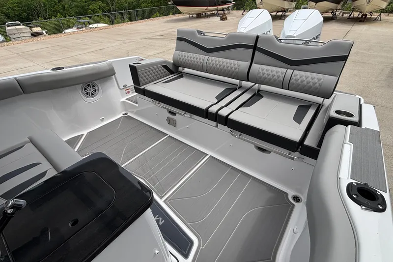 Slide: The Image of 2026 Monterey Elite 30 OB boat interior with sleek gray seating and modern design. - 22