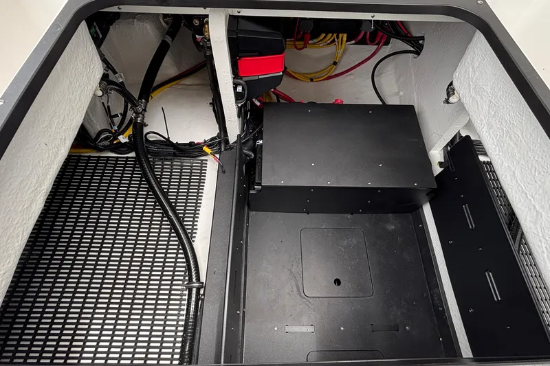 Slide: The Image of Engine compartment of 2026 Monterey Elite 30 OB boat, showcasing wiring and components. - 25