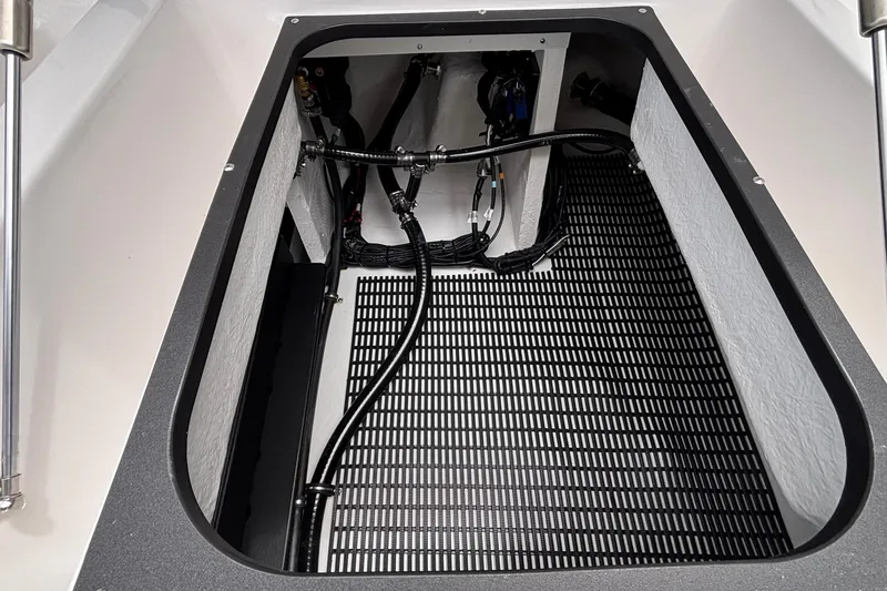 Slide: The Image of Engine compartment of 2026 Monterey Elite 30 OB boat, showcasing wiring and components. - 26