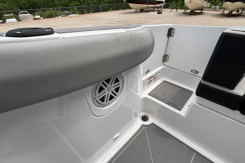 Slide: The Image of Interior view of 2026 Monterey Elite 30 OB boat, featuring seating and speaker. - 29