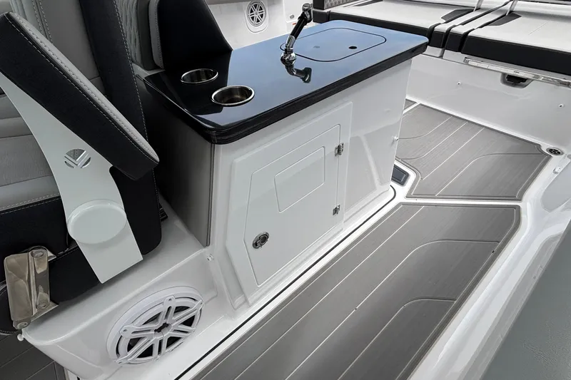 Slide: The Image of 2026 Monterey Elite 30 OB boat interior with sleek seating and modern amenities. - 32