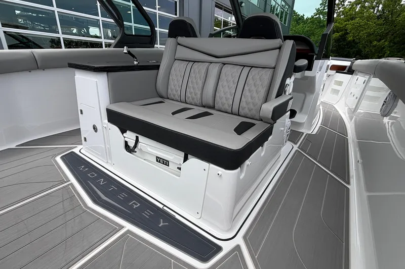 Slide: The Image of 2026 Monterey Elite 30 OB boat interior with luxurious seating and sleek design. - 34