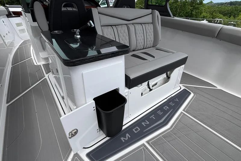 Slide: The Image of Luxurious interior of 2026 Monterey Elite 30 OB boat with sleek seating and modern amenities. - 37