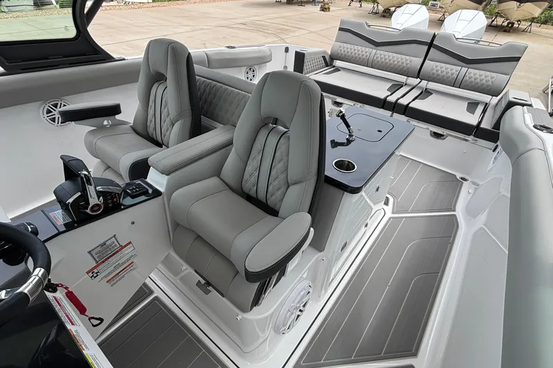 Slide: The Image of 2026 Monterey Elite 30 OB boat interior with luxurious seating and modern controls. - 39