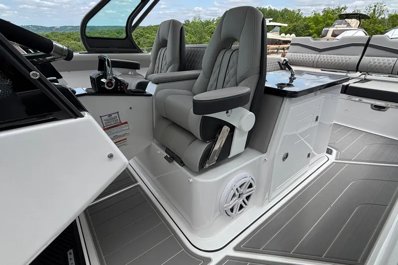 Slide: The Image of Luxurious interior of 2026 Monterey Elite 30 OB boat with plush seating and modern controls. - 40