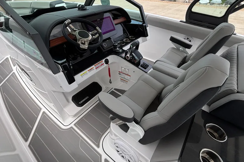 Slide: The Image of 2026 Monterey Elite 30 OB boat interior with modern helm and luxurious seating. - 41