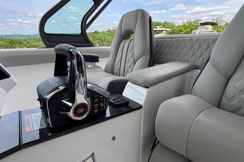 Slide: The Image of Luxury cockpit of 2026 Monterey Elite 30 OB boat with modern controls and plush seating. - 42