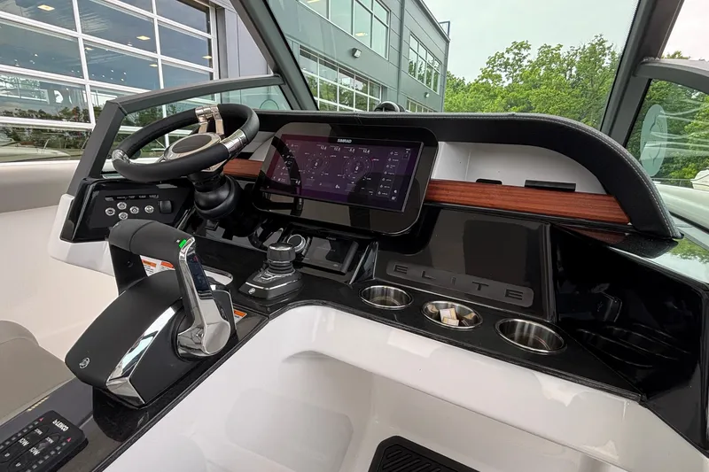 Slide: The Image of 2026 Monterey Elite 30 OB boat dashboard with modern controls and touchscreen display. - 46