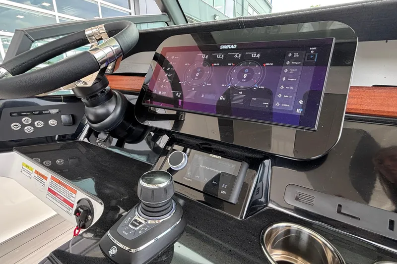 Slide: The Image of Dashboard of 2026 Monterey Elite 30 OB boat with advanced navigation display. - 47